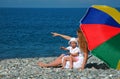 Happy mother with child under umbrella Royalty Free Stock Photo