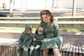 Happy mother with children in fashionable clothes family look in a park Royalty Free Stock Photo