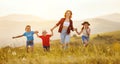 Happy mother with children having fun in countryside Royalty Free Stock Photo