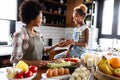 Happy mother and children in the kitchen. Healthy food, family, cooking concept