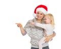 Happy mother in Christmas hat holding baby girl Royalty Free Stock Photo