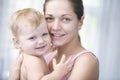 Happy Mother Cuddling Baby Girl Royalty Free Stock Photo