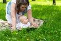 Happy mother and cute baby girl playing outdoor Royalty Free Stock Photo