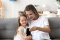 Happy mother and cute daughter laughing taking selfie on smartph Royalty Free Stock Photo