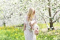 Happy Mother Dancing with Baby Daughter in Flowering Apple Orchard Royalty Free Stock Photo