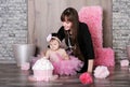 Happy mother and daughter celebrating first birthday. Royalty Free Stock Photo