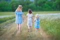 Happy mother and daughter child together with yellow dandelion flowers in summer day enjoy vacation free time together happy Royalty Free Stock Photo