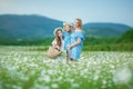 Happy mother and daughter child together with yellow dandelion flowers in summer day enjoy vacation free time together happy Royalty Free Stock Photo