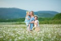 Happy mother and daughter child together with yellow dandelion flowers in summer day enjoy vacation free time together happy Royalty Free Stock Photo