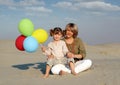 Happy mother and daughter with colorful balloons Royalty Free Stock Photo