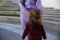 Happy mother with daughter in fashionable clothes family look in a park Royalty Free Stock Photo