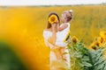 Happy mother with the daughter in the field with sunflowers. mom and baby girl having fun outdoors. family concept. mothers Day Royalty Free Stock Photo