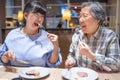 Happy mother and daughter having fun in  restaurant Royalty Free Stock Photo