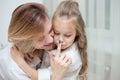 Happy Mother and daughter are hugging at home