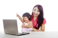 Happy mother and daughter with laptop Royalty Free Stock Photo