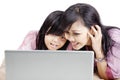 Happy mother and daughter with laptop Royalty Free Stock Photo