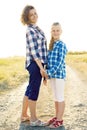 Happy mother and daughter laughing together outdoors Royalty Free Stock Photo