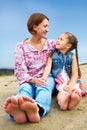 Happy mother and daughter laughing together outdoors Royalty Free Stock Photo