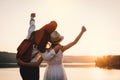 Happy mother and daughter looking at the sky during sunset Royalty Free Stock Photo