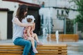 Happy mother and daughter in the park. Beauty nature scene with family outdoor lifestyle. Happy family resting together on the Royalty Free Stock Photo