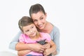 Happy mother and daughter sitting with pet kitten together Royalty Free Stock Photo