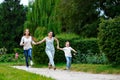 Happy Mother with daughter and son running on Royalty Free Stock Photo