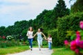 Happy Mother with daughter and son running on Royalty Free Stock Photo