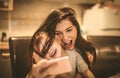 Mother and daughter take self portrait with smart phone. Royalty Free Stock Photo