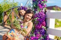 Happy mother and daughter under the arch for the wedding ceremony. Floristic composition in vintage style. The Provence.