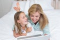 Happy mother and daughter using laptop Royalty Free Stock Photo