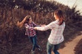 Happy mother and daughter on the walk on summer field. Family spending vacation outdoor Royalty Free Stock Photo