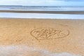 Happy Mother's Day written in the sand