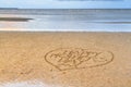 Happy Mother's Day written in the sand