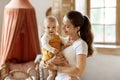 Happy mother enjoying time with adorable toddler son at home Royalty Free Stock Photo