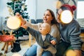 Mother, father and baby holding bauble Royalty Free Stock Photo