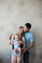 Happy mother, father and son playing