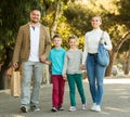 Family taking a walk in town Royalty Free Stock Photo