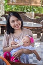 A happy mother gives milk to her baby daughter Royalty Free Stock Photo