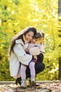 Happy Mother Having Fun with her Child in the Autumn Forest Royalty Free Stock Photo