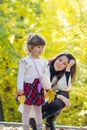 Happy Mother Having Fun with her Child in the Autumn Forest Royalty Free Stock Photo