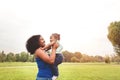 Happy mother having fun with her daughter in park outdoor - Loving family enjoying time together Royalty Free Stock Photo