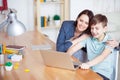 Happy mother helping his son to do homework Royalty Free Stock Photo