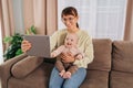 Smiling mom and her baby having video call on tablet at home Royalty Free Stock Photo