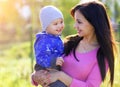 Happy Mother and her Child enjoy the early Spring in Park Royalty Free Stock Photo