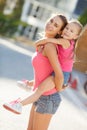 Happy mother and her daughter playing outdoors Royalty Free Stock Photo