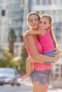 Happy mother and her daughter playing outdoors Royalty Free Stock Photo