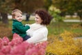 Happy mother and her little boy. Child playing with mother in the park. Mother and son embracing Royalty Free Stock Photo