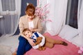 Happy mother and her little child reading bedtime story at home. Royalty Free Stock Photo