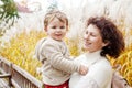 Happy mother and her little child. Smiling child playing with mother in the park. Mother and son embracing Royalty Free Stock Photo