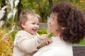 Happy mother and her little child. Smiling child playing with mother in the park. Mother and son embracing Royalty Free Stock Photo